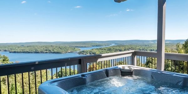 Hot tub on balcony overlooking Deep Creek Lake.
