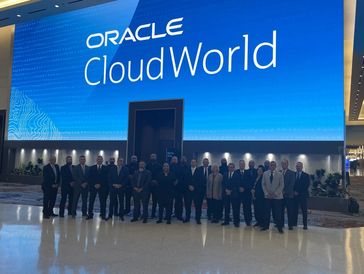 Group photo at Oracle CloudWorld event.