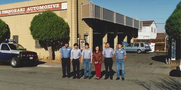 Fujie and our auto technicians (circa 1990)