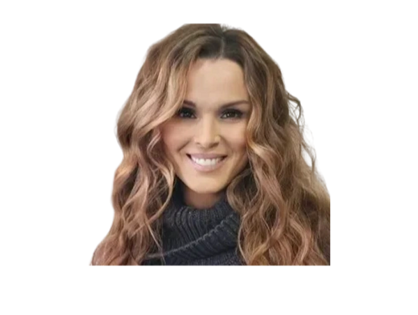 Smiling woman with long wavy hair and a dark turtleneck sweater.