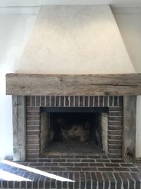 fireplace plaster wood brick neutral palette rustic french country