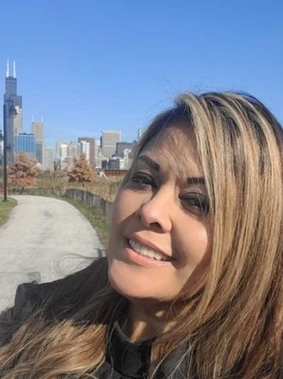 Maria Valdez selfie with Chicago skyline in the background
