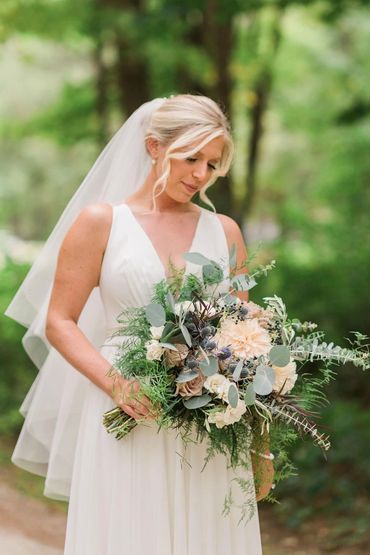 Blonde Bride with her bouquet bridal hair