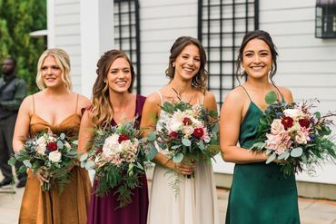 bridesmaids holding flowers 

