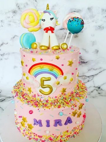 Unicorn birthday Cake with handcrafted fondant toppers
