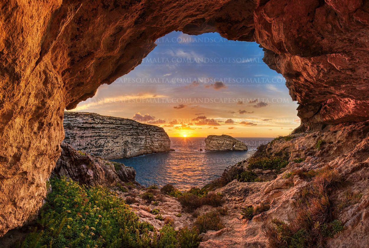 Cave in San larenz near the fungus rock in Gozo. Photographed at sunset by Derren Vella