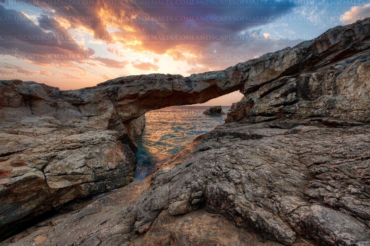 Natural arch in Qala Gozo at Sunrise.
Landscape photography in Gozo at sunrise and sunset.