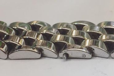 Drilling 4 holes on 2 ends beads, place steel sticks in the holes, and weld then polish