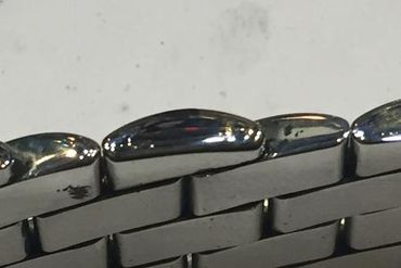 Drilling 4 holes on 2 ends beads, place steel sticks in the holes, and weld then polish