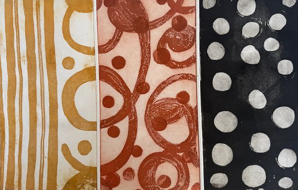 Abstract patterned textile or paper with circular and linear designs in earthy tones.