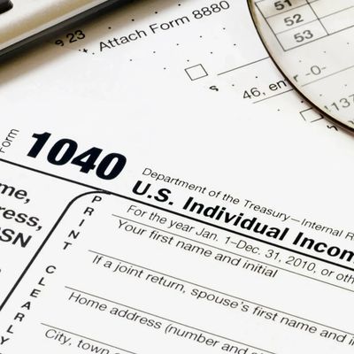 form 1040 and a magnifying glass
