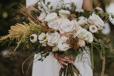 Autumn bridal bouquet with textured roses, zinnias, amaranthus, and yarrow in neutral tones