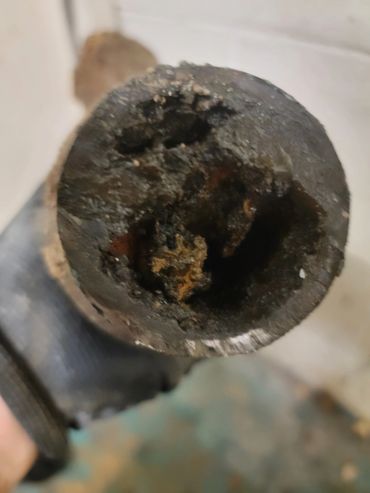 Kitchen sink drain full of grease and build up