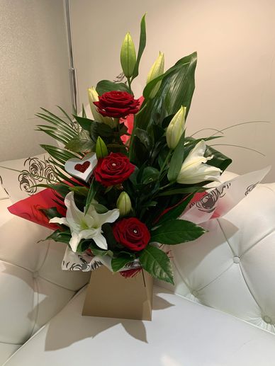 Beautiful boxed arrangement no need for a vase any colour roses available.