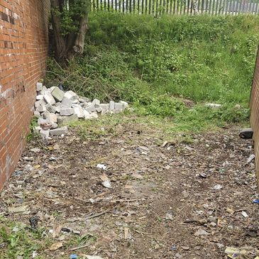 AN AREA THAT HAS BEEN CLEARED OF OLD TYRES AND RUBBISH BY WASTE BUSTERS STAFFORDSHIRE