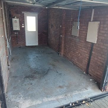 A GARAGE THAT HAS BEEN CLEARED OF RUBBISH BY WASTE BUSTERS STAFFORDSHIRE