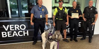 City of Vero Beach Police Chief and department staff accept the Service Animal Champion Award from S