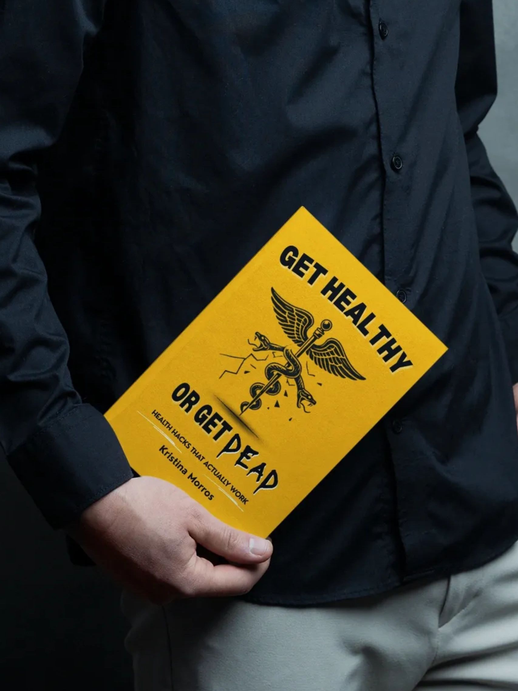 man holding a health and wellness book