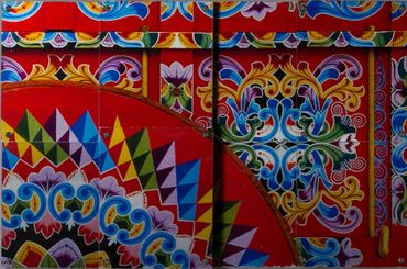 Colorful, close-up, geometric photo across four metal tiles