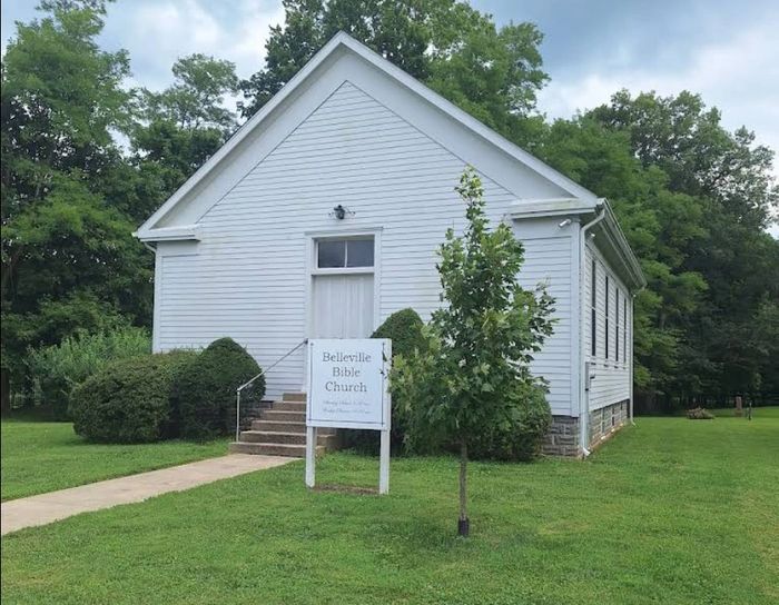 Small white church with a sign reading Belleville Bible Church.
