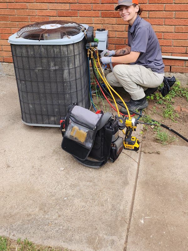 Technician checking the charge during 100°f day