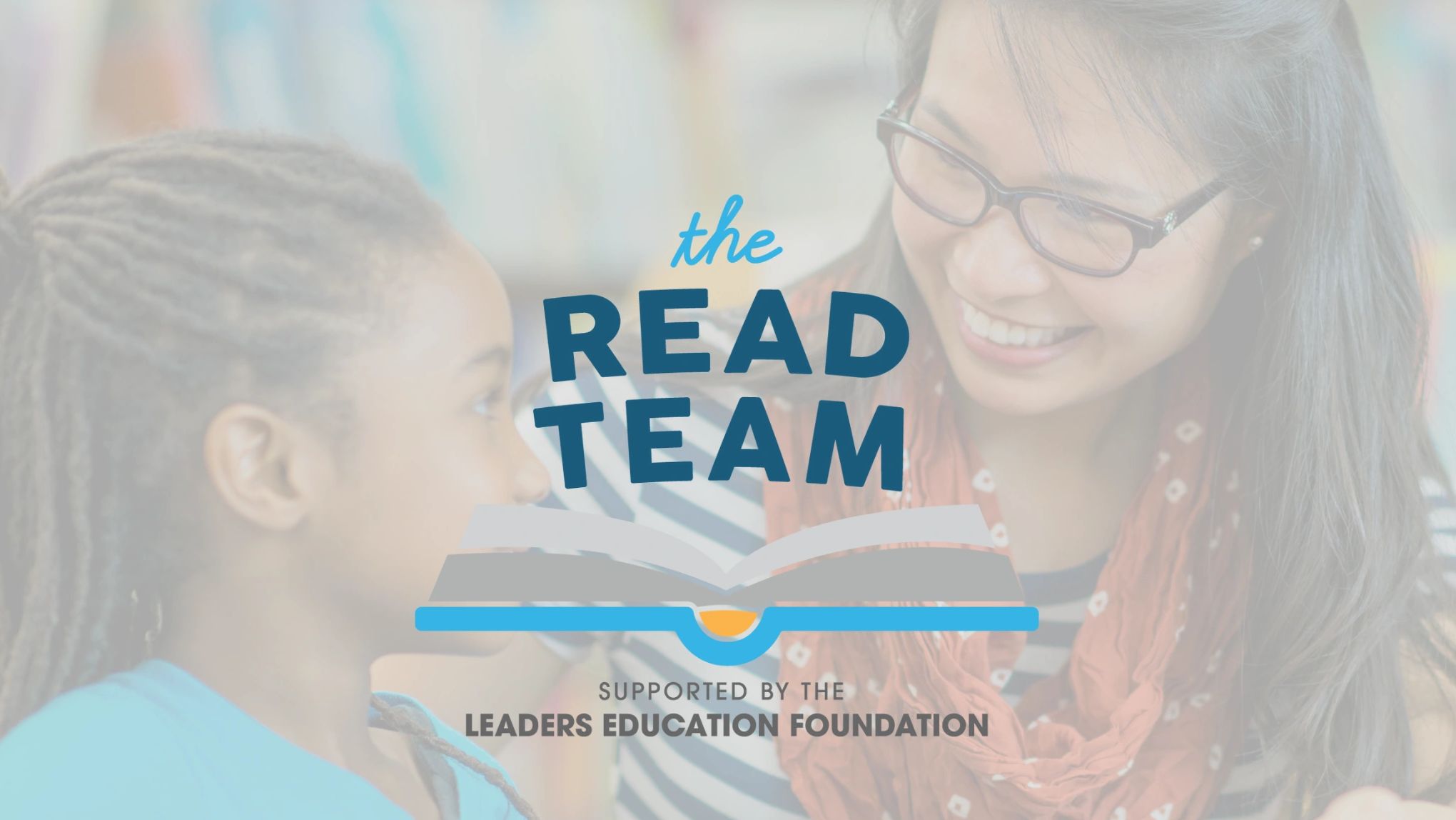 The READ Team logo over an adult smiling at a young child