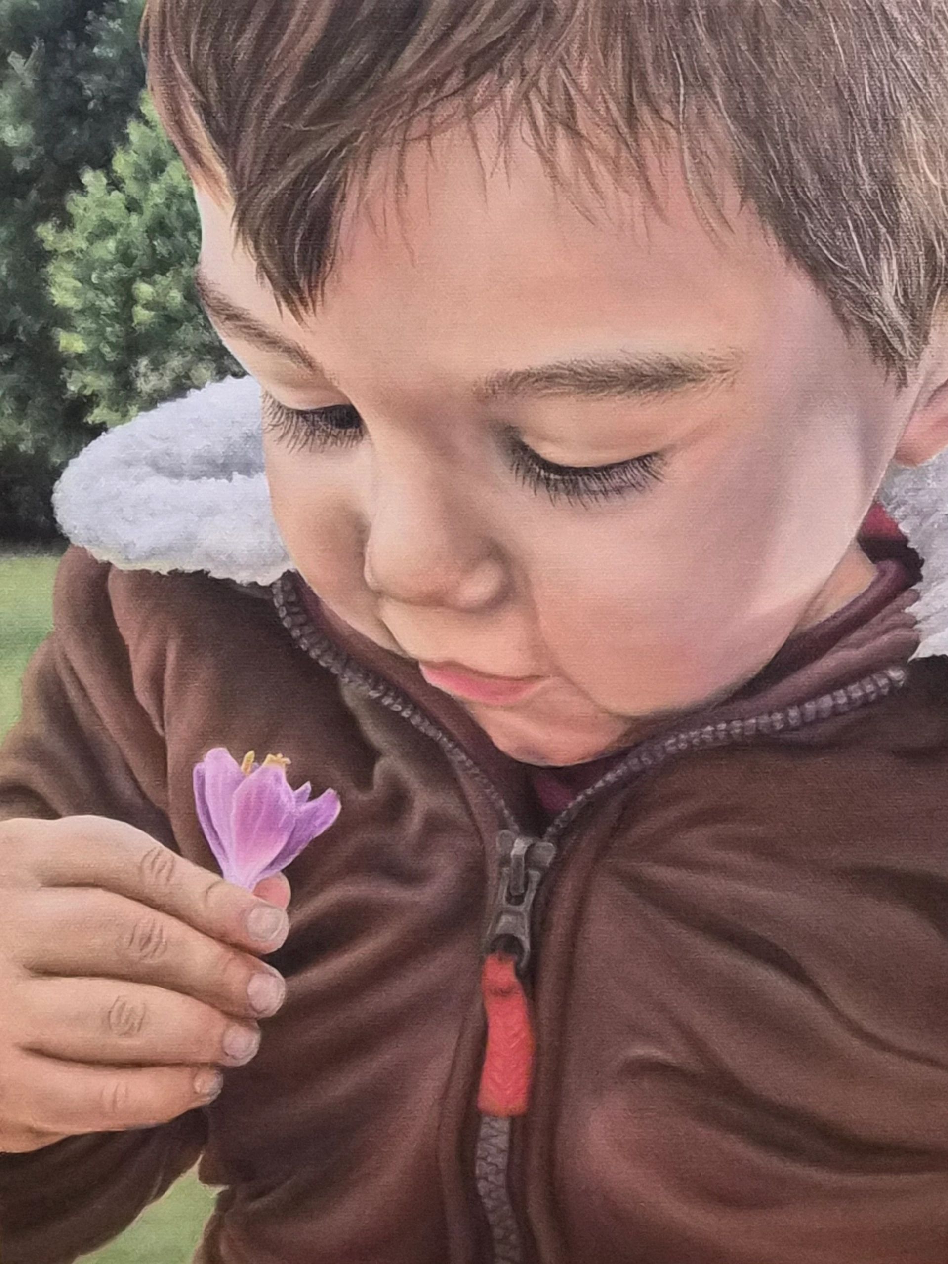 Oil painting of gentle boy outside with flower