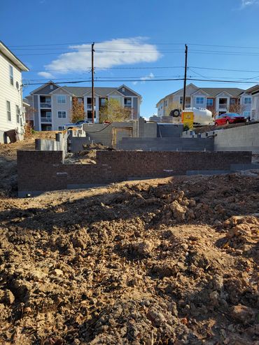 Construction site showing early stages of a house build
