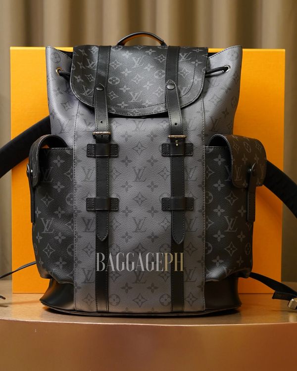 Black Louis Vuitton backpack with monogram design.