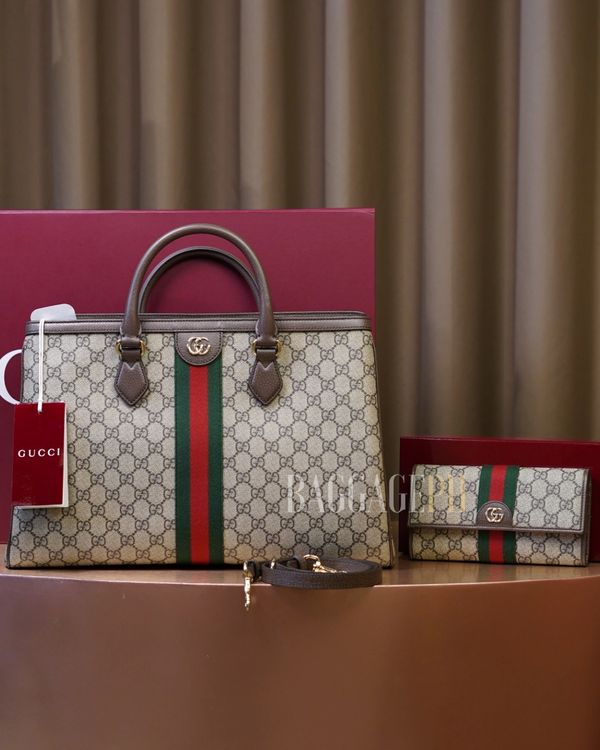 Gucci handbag and matching wallet with signature green-red-green stripe.