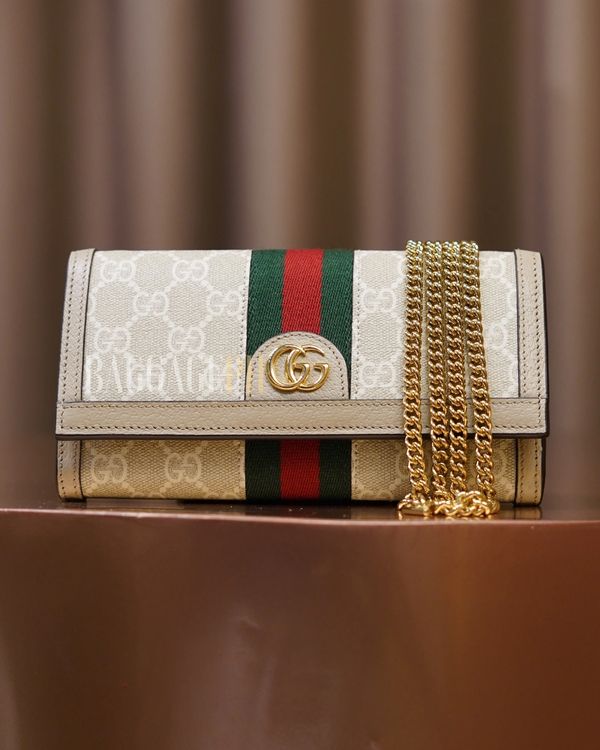 Elegant Gucci purse with signature GG logo and gold chain strap.