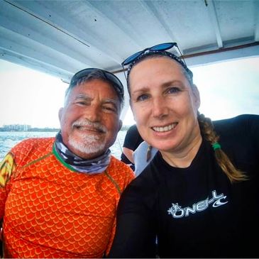 two people on a dive boat