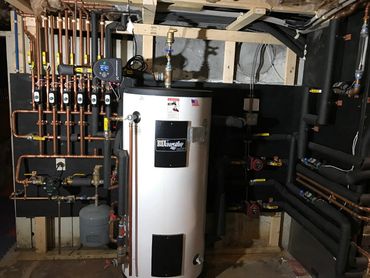 Geothermal System Water to Water Open Loop Well Piping by EarthTech Systems