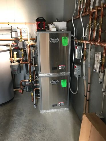 Hydron Water to Water Two units stacked Geothermal Heat Pumps by EarthTech Systems