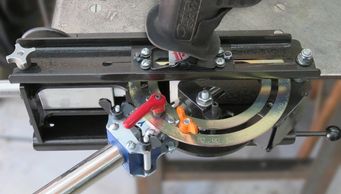 Image of Miter-Notcher cutting tube attached to clamp with angles set.
