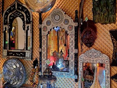 Camel Bone and White Metal Decorated Moroccan Arch Wood Mirrors, African Dan Mask, Ceramic Fez Plate