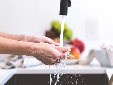 Washing hands in the kitchen with ozone water