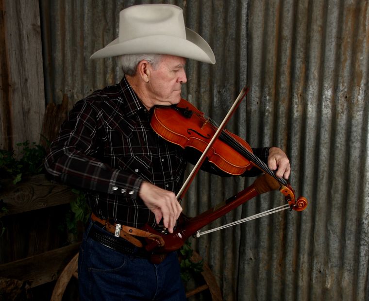 Handmade Gut Strap holds fiddle-fretting over the top