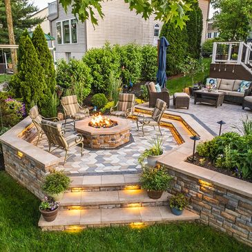 Cozy backyard patio with fire pit and comfortable seating.