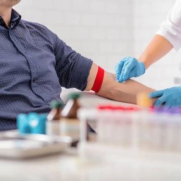 Person getting blood drawn at a clinic.
