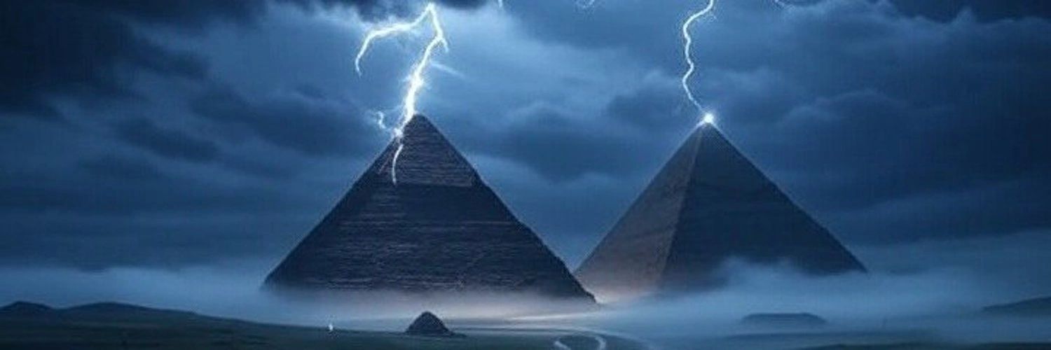 Lightning strikes two pyramids under a stormy sky.