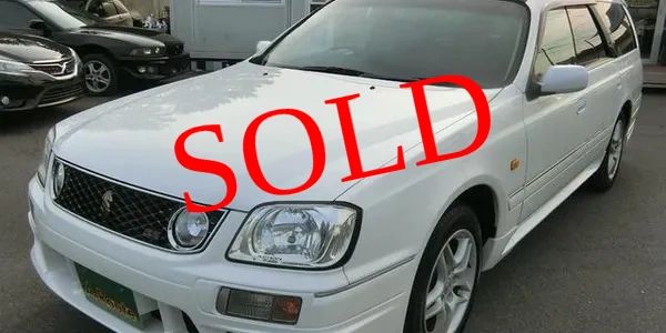 White car with SOLD text overlay.