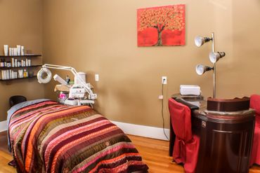 Treatment room with striped spread and manicure table