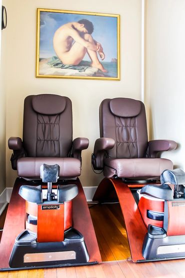 Pedicure chairs and painting in room