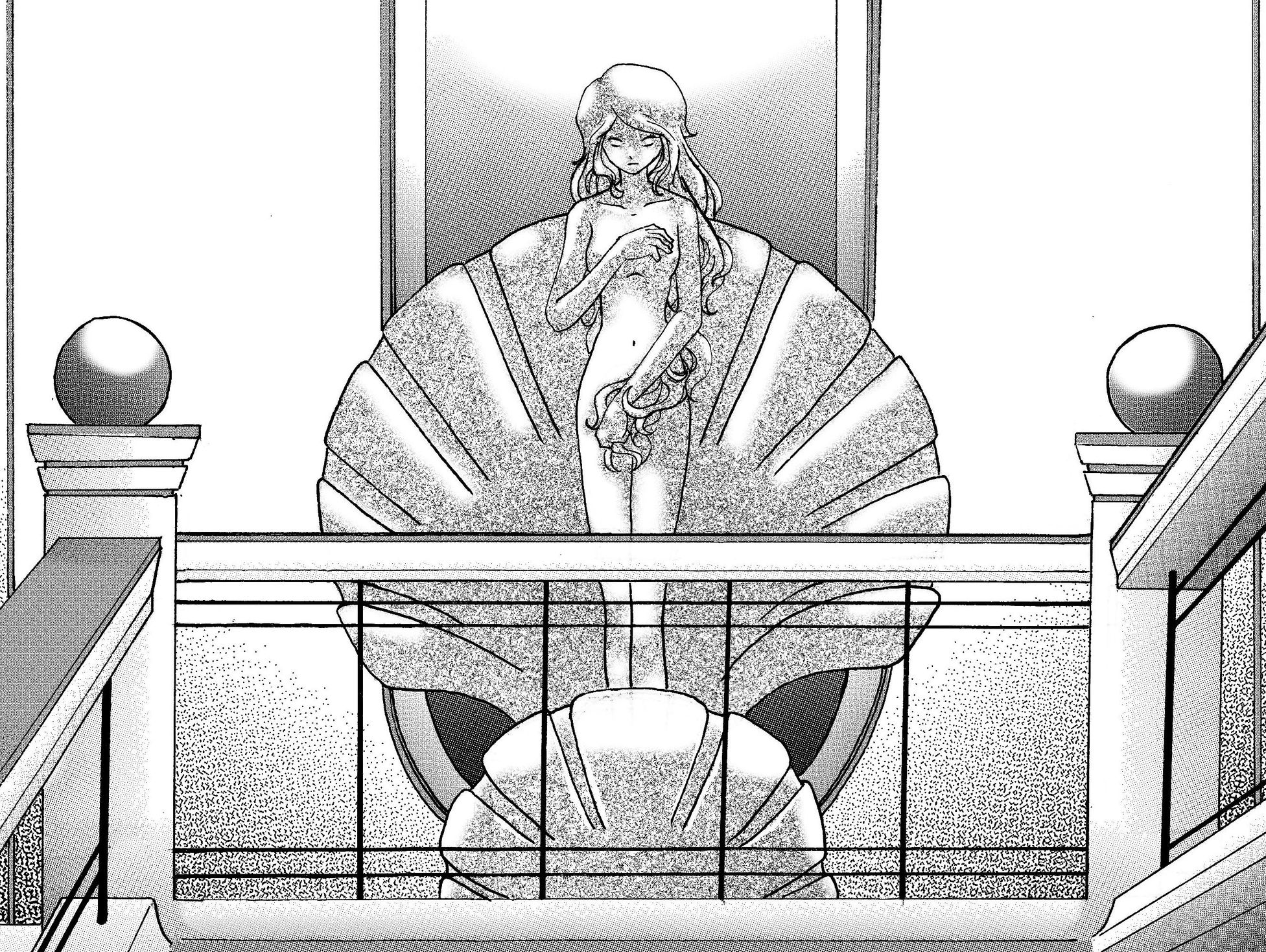 A statue of a woman emerging from a large shell on a balcony.