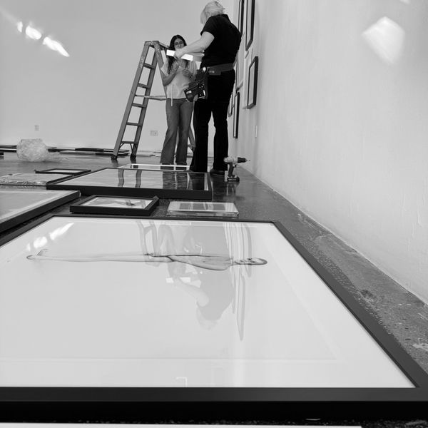 Artwork organized on the ground ready to be installed.