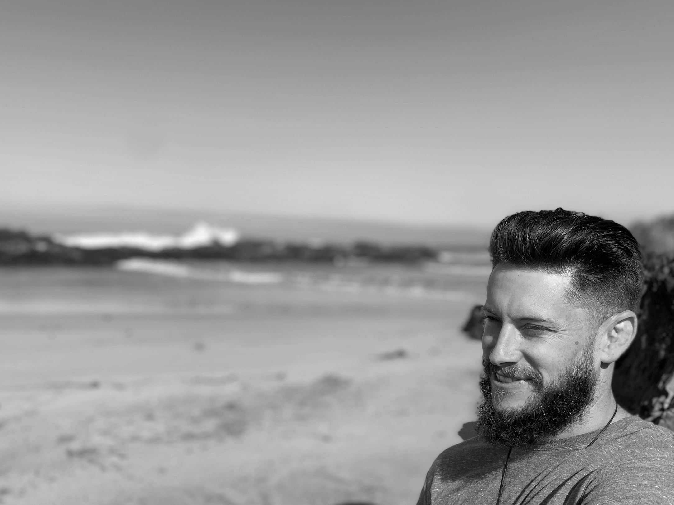 elden vala at the beach smiling.