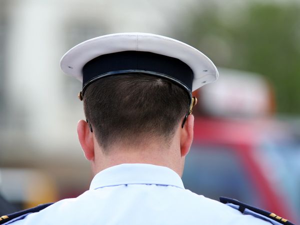 This is the back of the head of a naval officer.