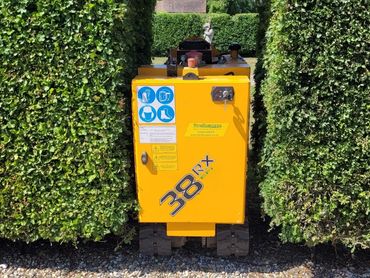 This hedge archway was only 30 inches wide. Tight access to sites is not a problem for our machine,