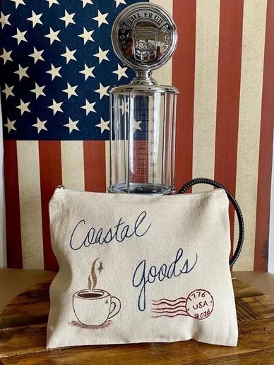 A hand-painted canvas zip pouch influenced by seaside towns, American coastal travel, general stores